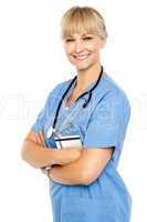 Happy and confident doctor posing arms crossed