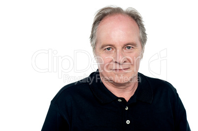 Relaxed senior caucasian male looking at you