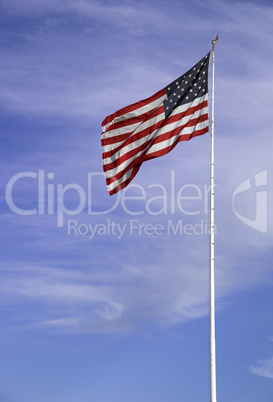 US flag against blue sky
