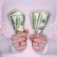 Woman holding cash tightly