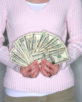 Woman holding cash fanned out