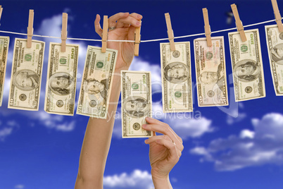 Hanging money on a clothes line