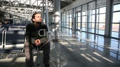 young man waiting his flight