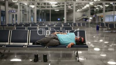 sleeping in airport with eye cover