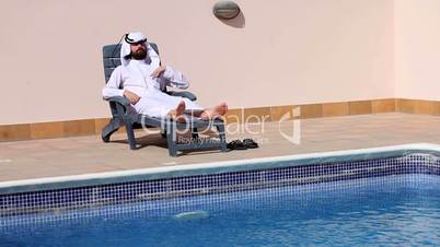 arabian talking phone at pool
