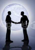 Men Shake Hands in Front of a Globe