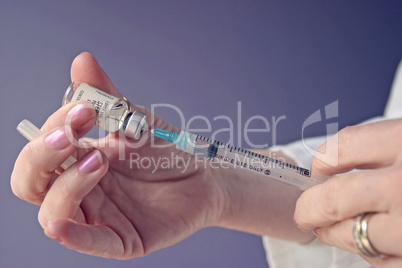 Nurse Filling Syringe