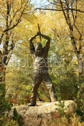 Statue of Nevada miner swinging axe