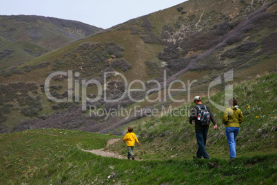 Family hiking on park trail