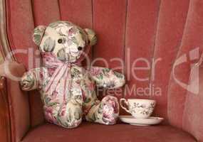 Calico Teddy Bear Has Tea on Chair