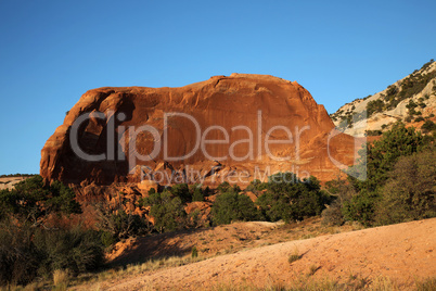 Red rock cliff resembling car