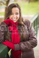 Pretty Woman Portrait Wearing Red Scarf and Mittens Outside