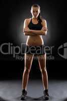 Fitness woman sport young posing on black