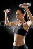 Fitness woman exercise weights on black
