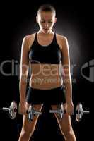 Fitness woman exercise weights on black