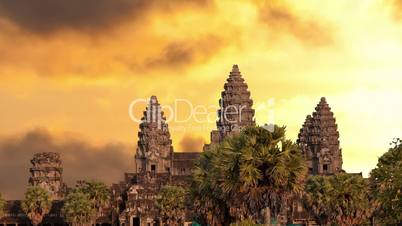 Angkor Wat temple silhouette with sunset sky and clouds