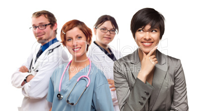 Young Mixed Race Woman with Doctors and Nurses Behind