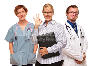 Businesswoman Making Okay Hand Sign with Doctors or Nurses