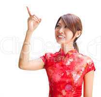 Chinese girl pointing at blank space
