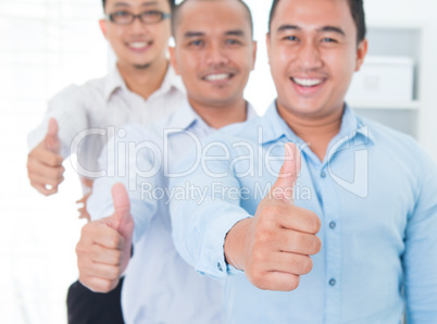 Thumbs up Southeast Asian businessmen