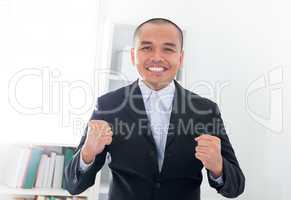 Excited Southeast Asian businessman