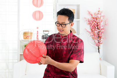 Chinese man decorating house