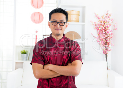 Chinese man standing indoors