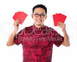Asian Chinese man holding red packet