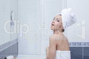 Young woman in towel - bathroom interior