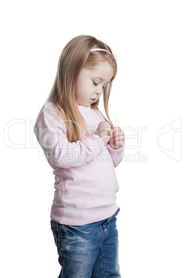 Cute little girl in sweater and jeans