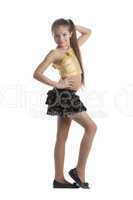 Dancer in gold top and black skirt