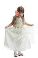 Pretty little girl in beige dress