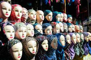 Closeup of the heads of a mannequin in hijab