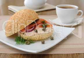 Salmon sandwich and a cup of coffee