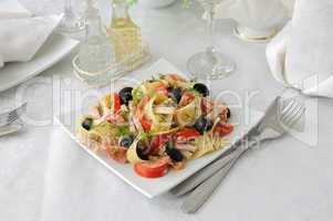 pasta salad with ham, tomato and olives