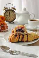 mini cherry strudel with a cup of coffee
