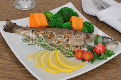baked sea bass with broccoli and carrots