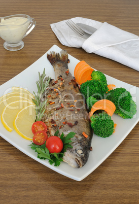 baked sea bass with broccoli and carrots