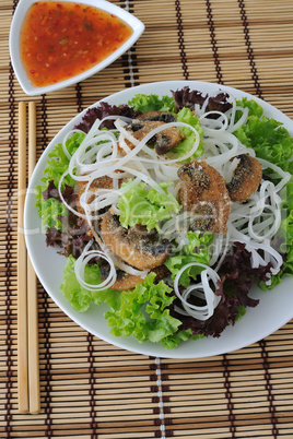 rice noodles with mushrooms in breadcrumbs in lettuce leaves