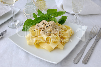 italian pasta - pappardelle with chicken fillet in a creamy sauc