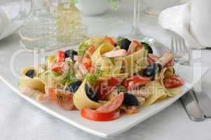 pasta salad with ham, tomato and olives