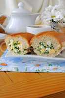 baguette stuffed with spinach, onion and egg