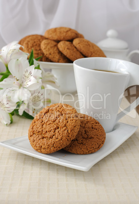 a cup of tea with oatmeal cookies