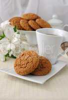 a cup of tea with oatmeal cookies