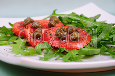 salad with fresh tomatoes, capers and arugula