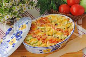 casserole of pasta with zucchini and tomato with cheese