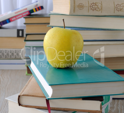 apple on stack of books