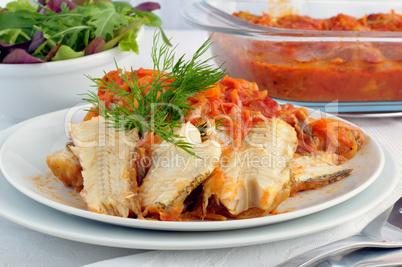 Baked fish in tomato sauce with vegetables
