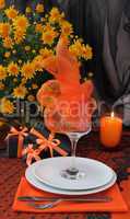 A fragment of a festive table for Halloween with gifts