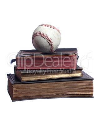 old baseball on old books